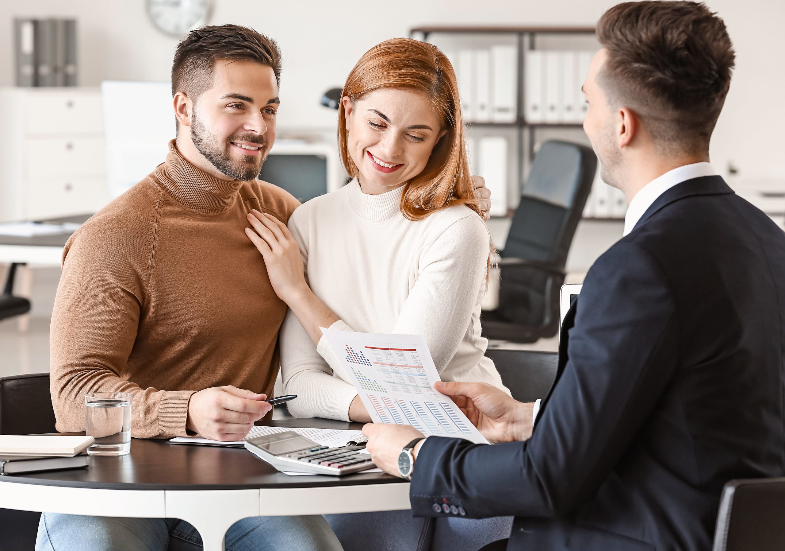 Bank manager working with clients in office